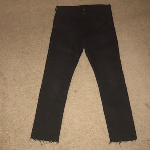 Black jeans with rips in knee